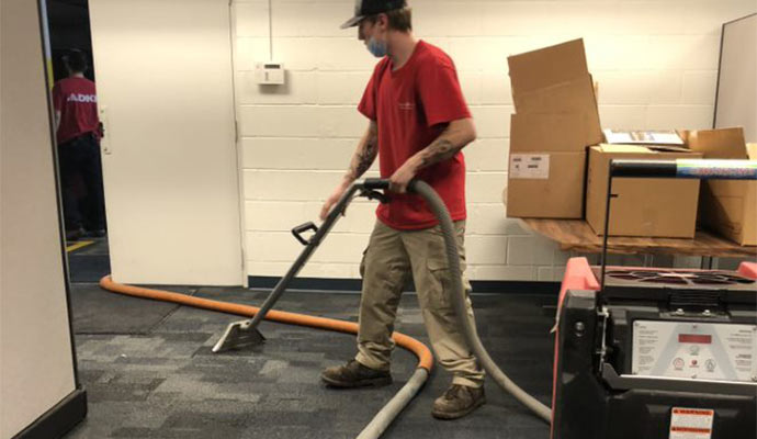 worker restoring damaged property